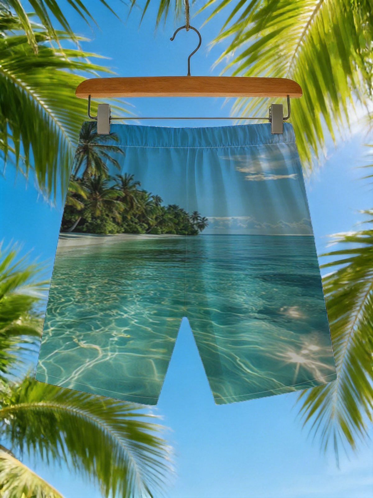 Crystal-clear turquoise waters meet a pristine white sand beach lined with lush palm trees under a bright blue sky. -  Beach shorts