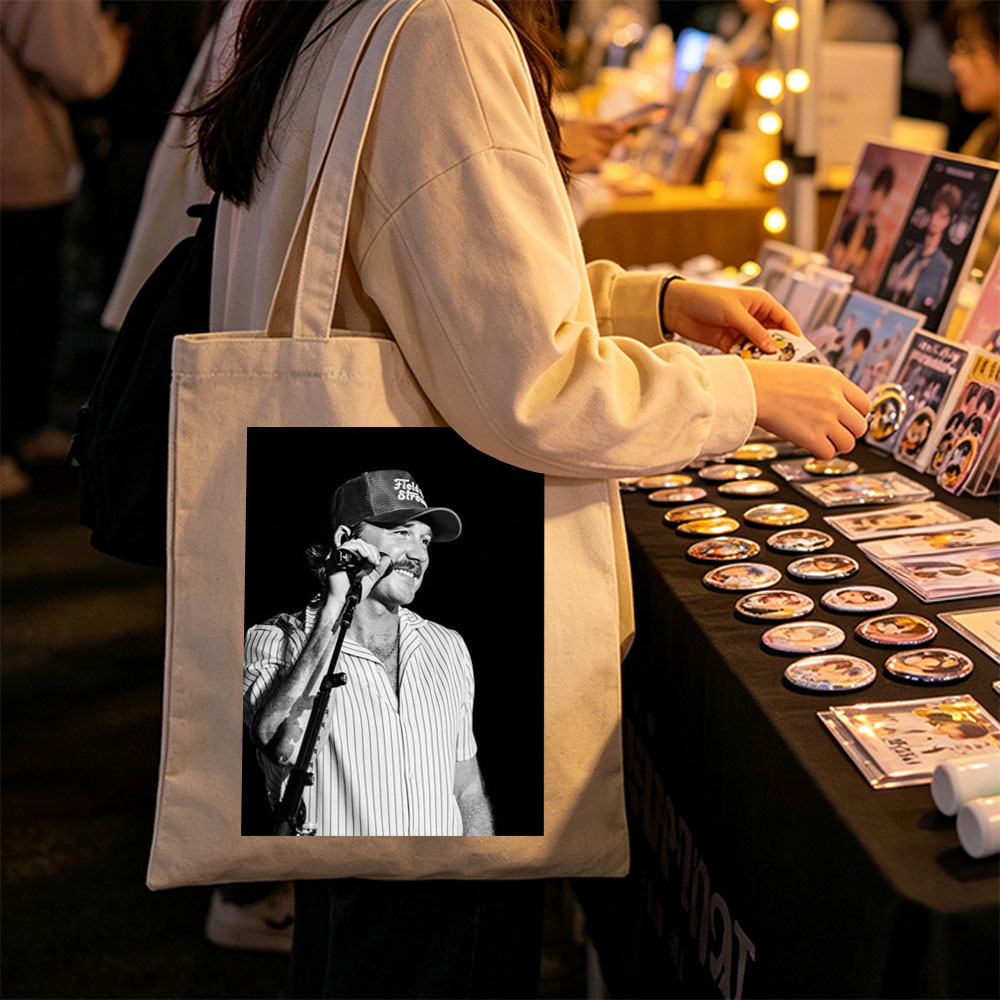 Ronnie Milsap Performing on Stage with Microphone in Black and White Photo - Canvas tote bags