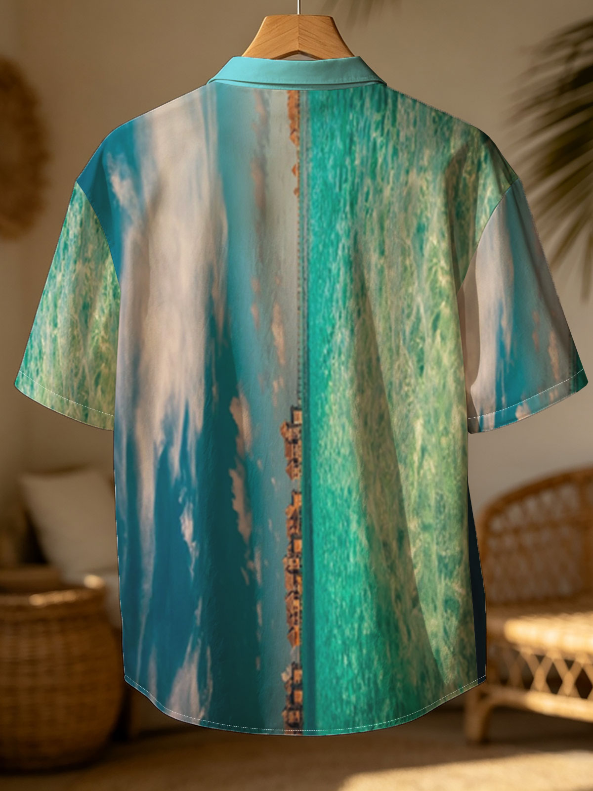 Overwater bungalows stretch into turquoise waters under a vibrant sky. -  Shirt