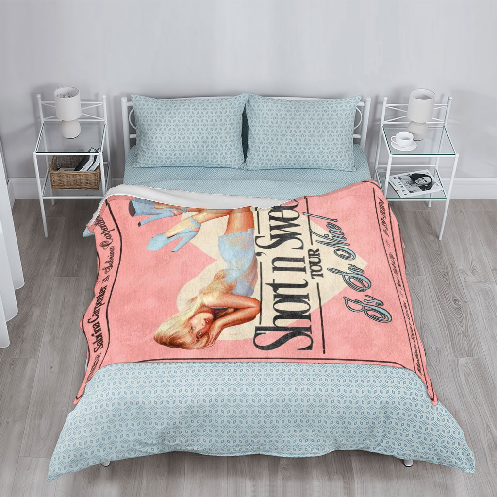 Sabrina Carpenter Short n' Sweet Tour Poster Featuring Her in a Blue Dress and Heels Lying on a Heart Background - Blankets