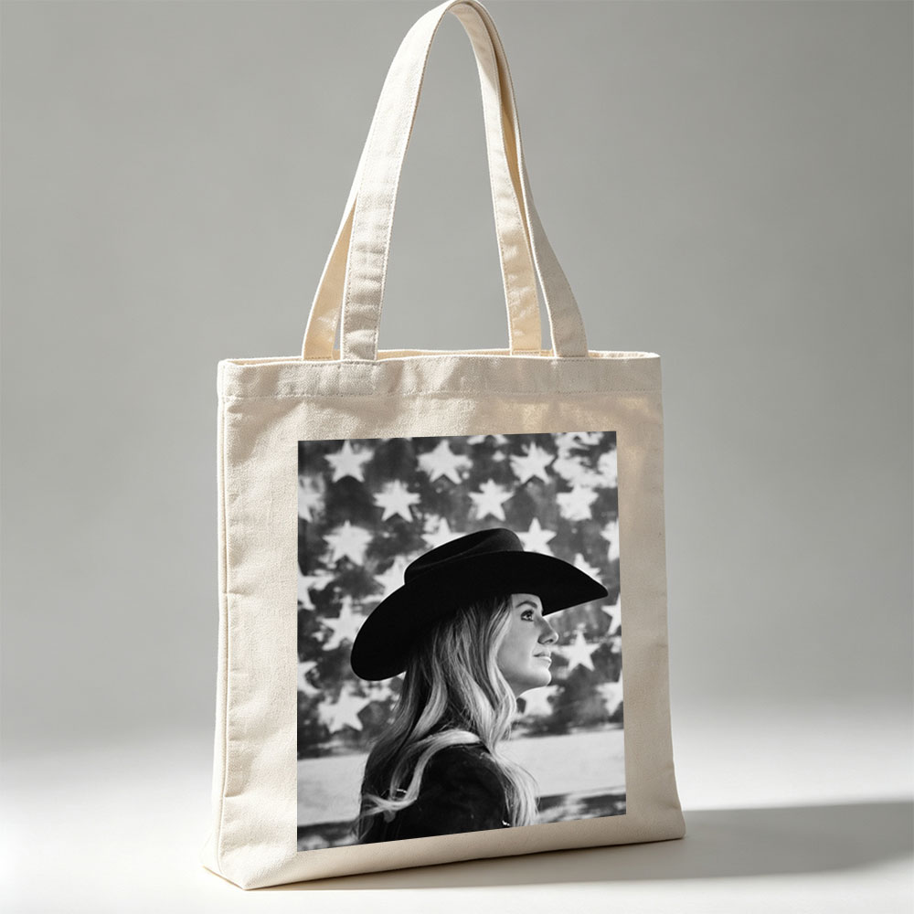 Carrie Underwood in Cowboy Hat with American Flag Background – Black and White Portrait - Canvas tote bags