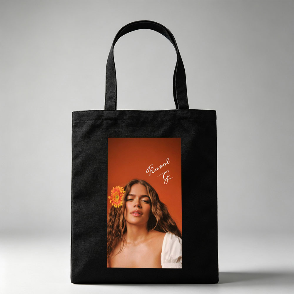 Ranal G with a vibrant orange flower in her hair against a warm terracotta background - Canvas tote bags