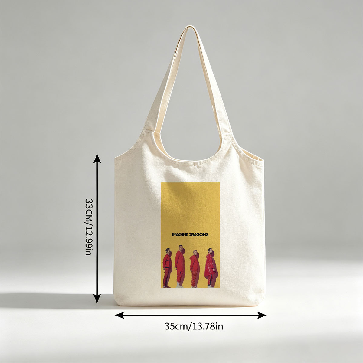 Imagine Dragons Standing in Red Outfits Against a Yellow Background - Canvas shoulder bags/