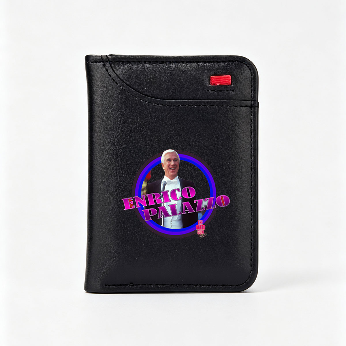 Enrico Palazzo from The Naked Gun, portrayed by Leslie Nielsen, in a comedic tuxedo scene. - Vertical Style Wallet