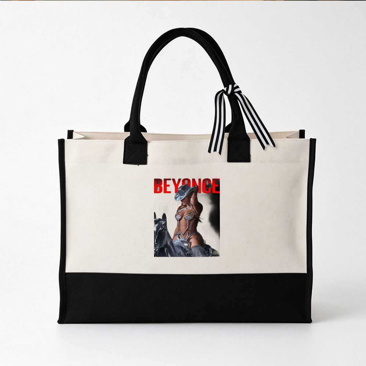 Beyoncé in a shimmering silver outfit and hat, posing confidently against a dark background with bold red text above. - Canvas patchwork gift tote bag