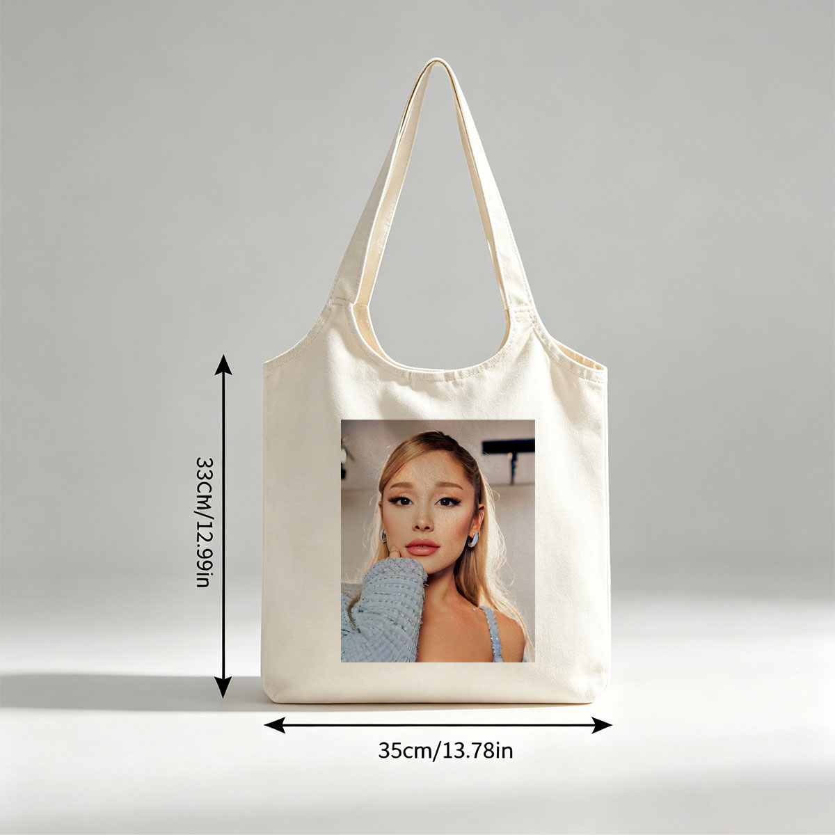 Ariana Grande in a Serene Moment Wearing a Light Blue Textured Top and Elegant Earrings - Canvas shoulder bags/