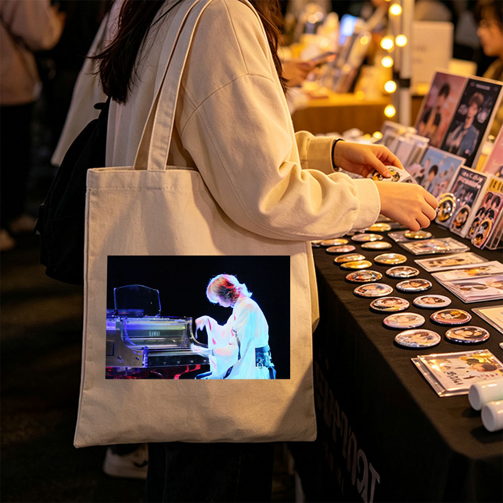 Yuki Kajiura Performing Piano on Stage with Dramatic Lighting - Canvas tote bags