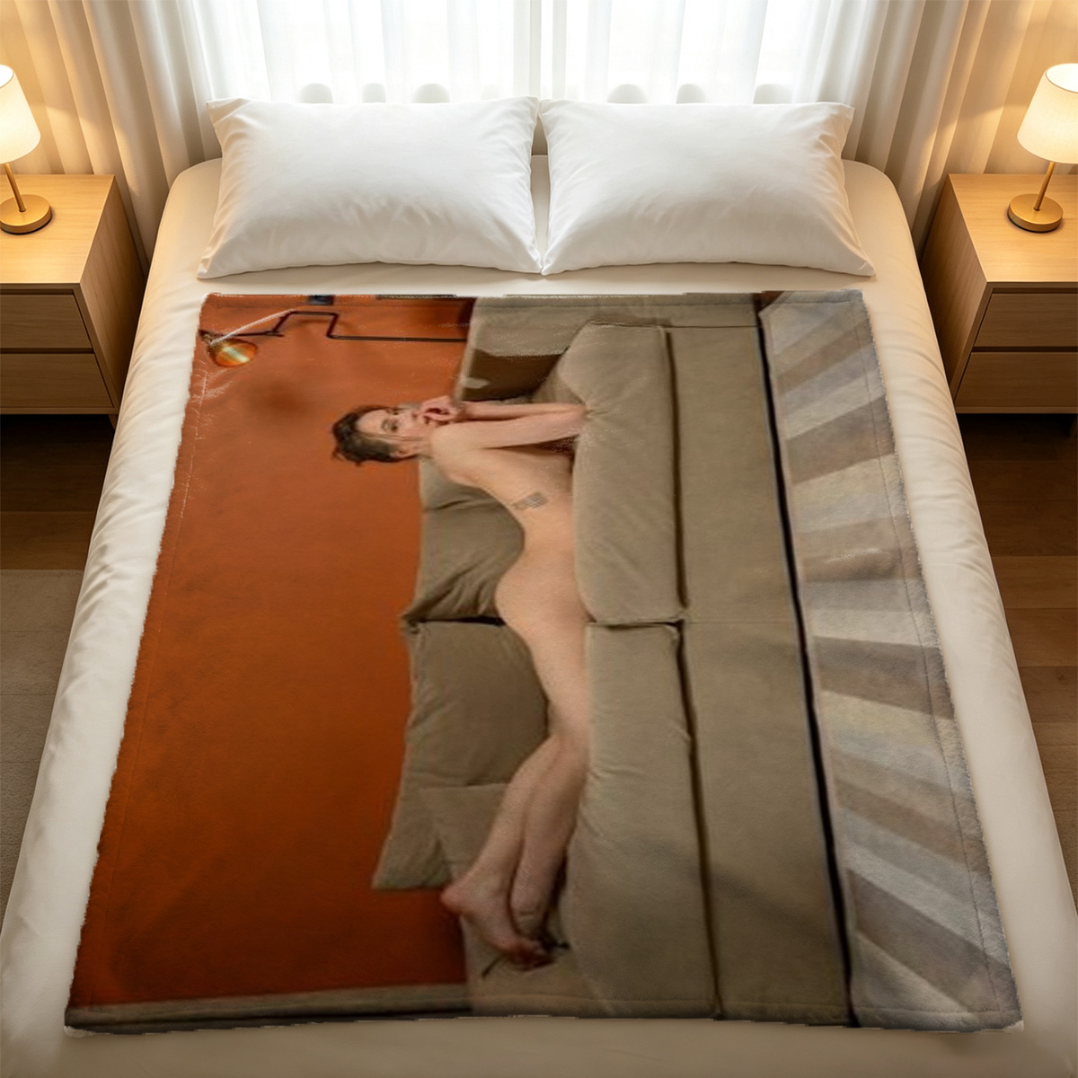A woman in orange lingerie and black stockings lying on a white bed, stretching black pantyhose. - Blanket