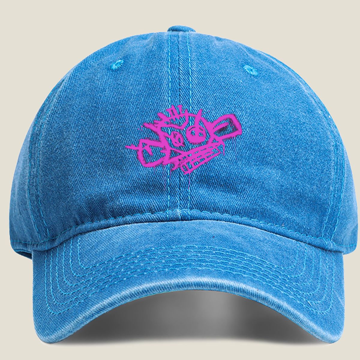 Graffiti-style pink skull with crown and crossbones on black background - Washed Denim - Baseball Cap