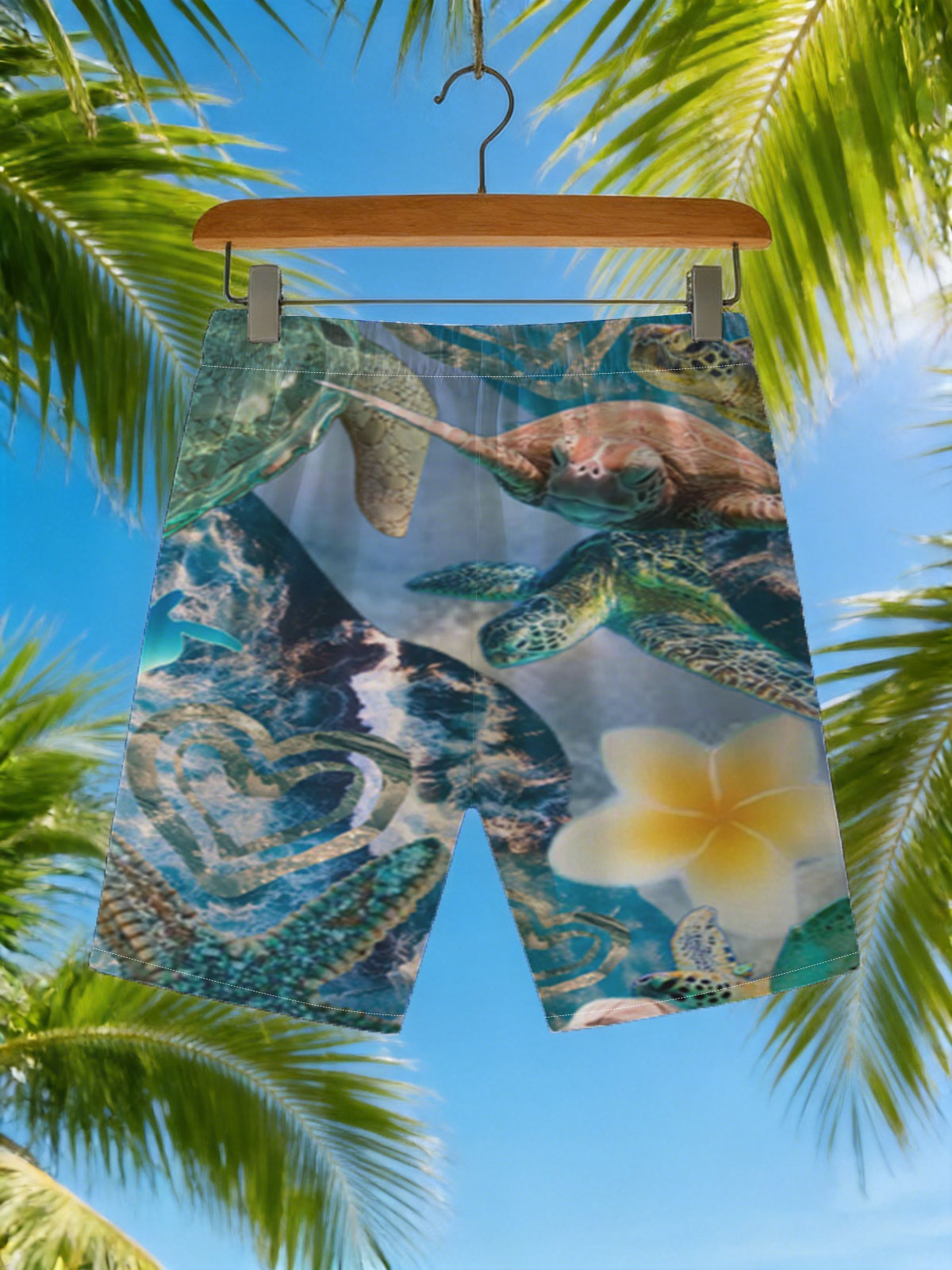 Turtles, stars, and flowers in a heart-filled ocean scene -  Beach shorts