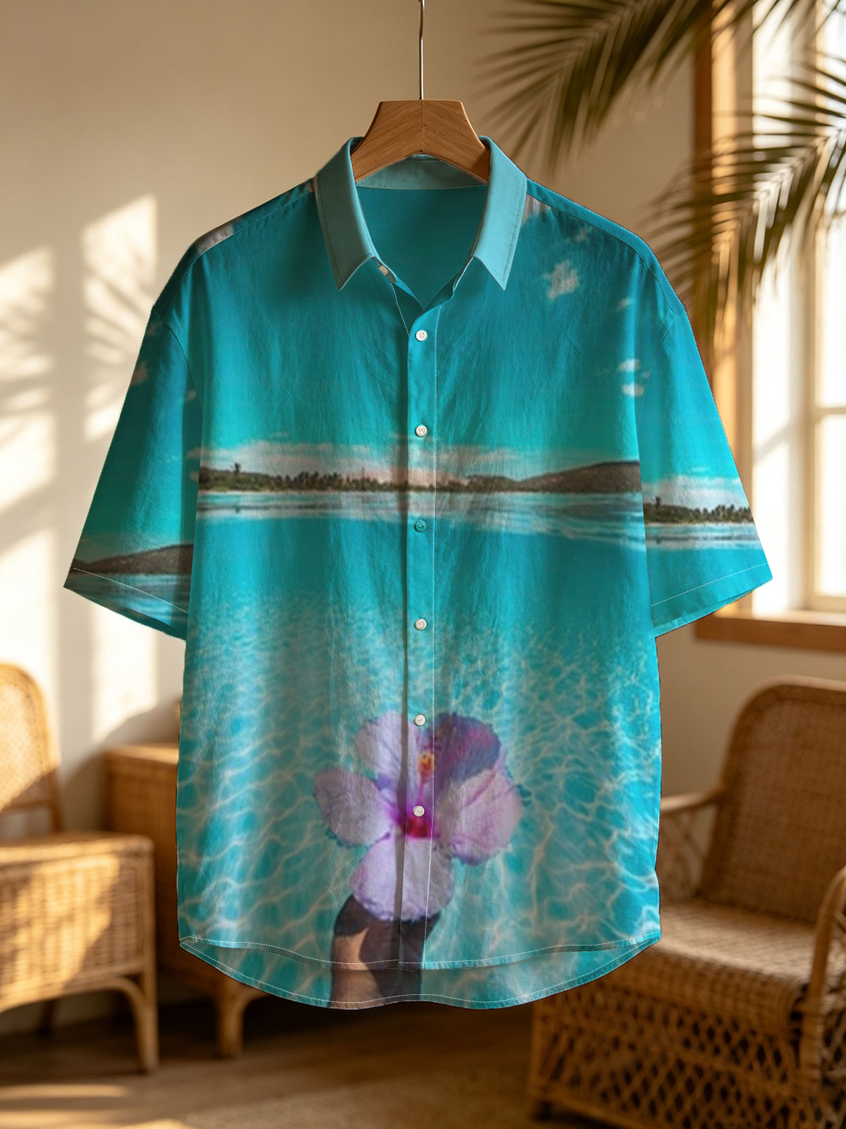 Hand holding a pink hibiscus flower over crystal-clear turquoise water under a bright blue sky. -  Shirt