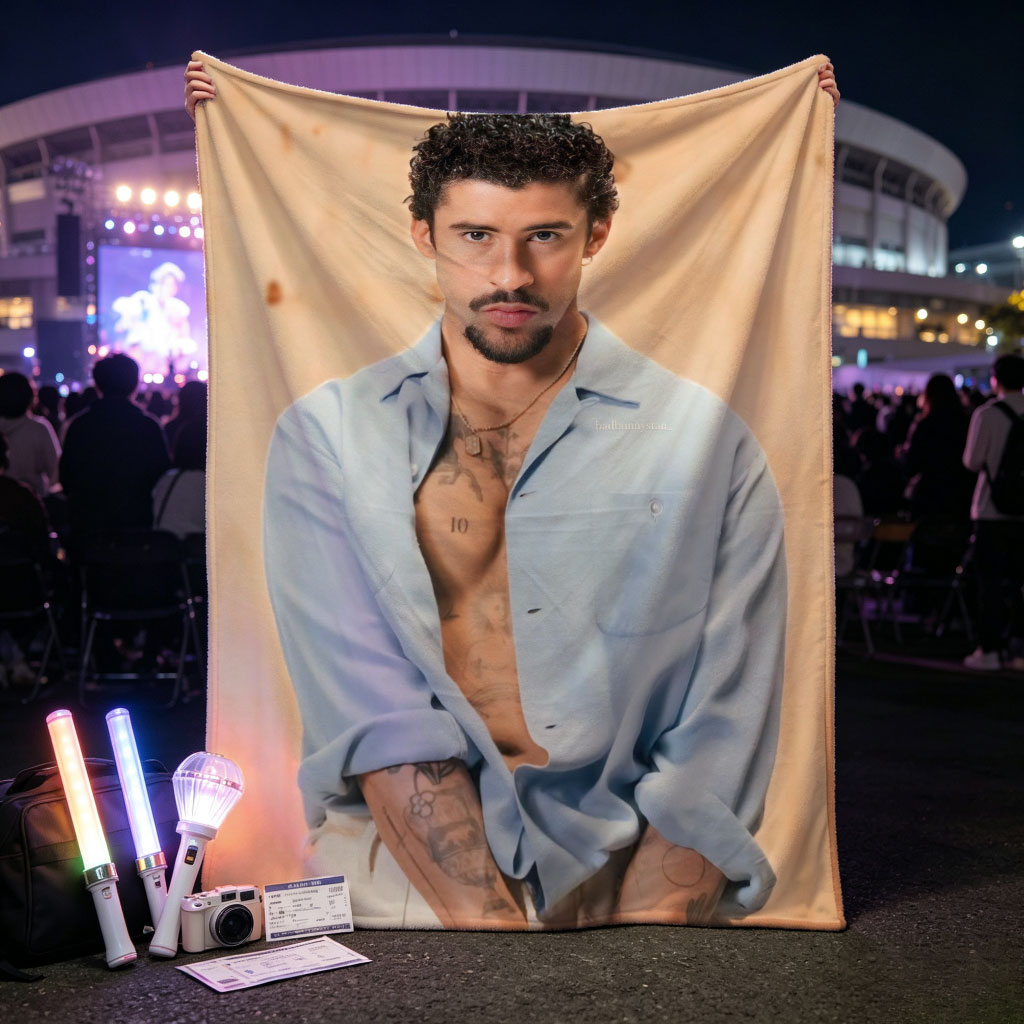 Bad Bunny in a Casual Pose Wearing an Open Light Blue Shirt and White Pants with Visible Tattoos - Blankets