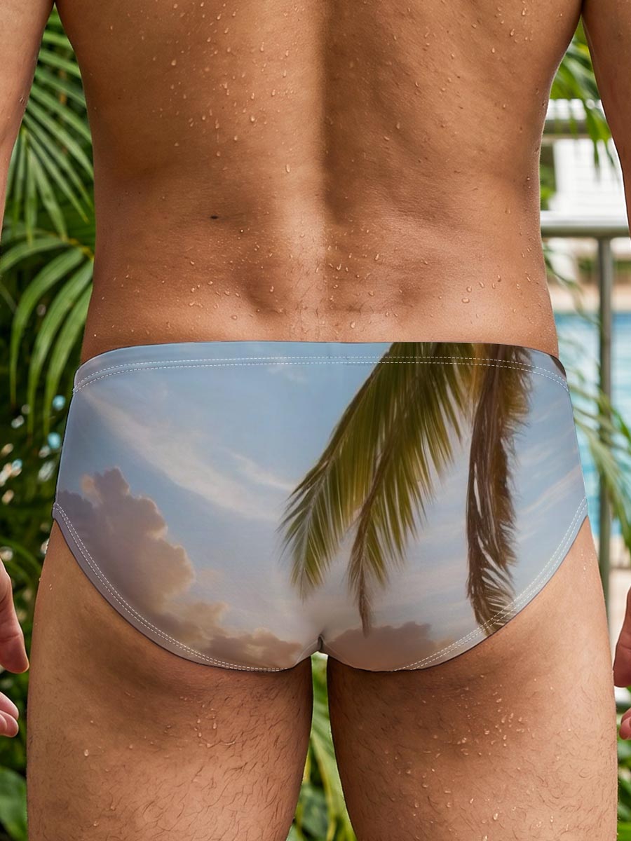 Sunset on a tropical beach with palm trees and calm ocean waves. -  Men's swim trunks