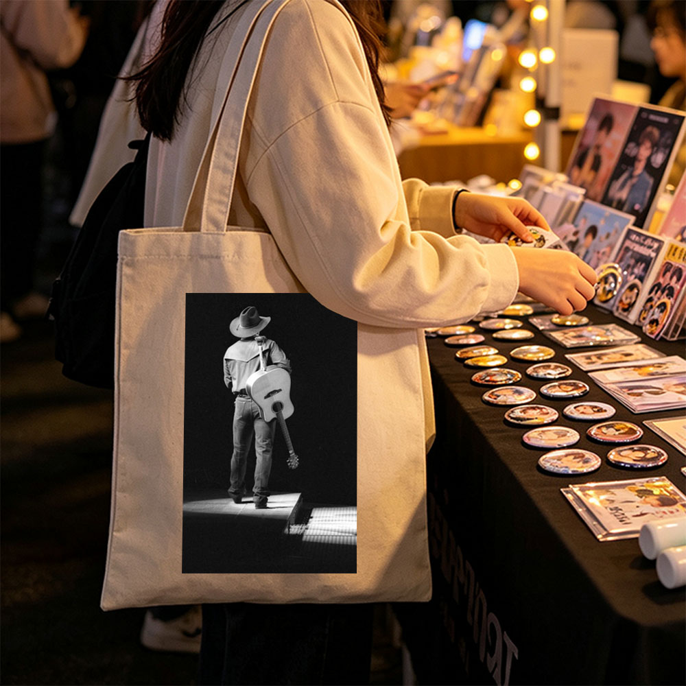 Willie Nelson on Stage with Acoustic Guitar in Black and White Portrait - Canvas tote bags