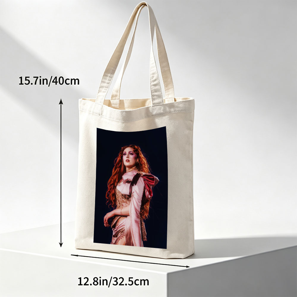 Katy Perry in a Dramatic Performance Scene Wearing a Pink Satin Outfit with Elegant Makeup and Long Red Hair - Canvas tote bags