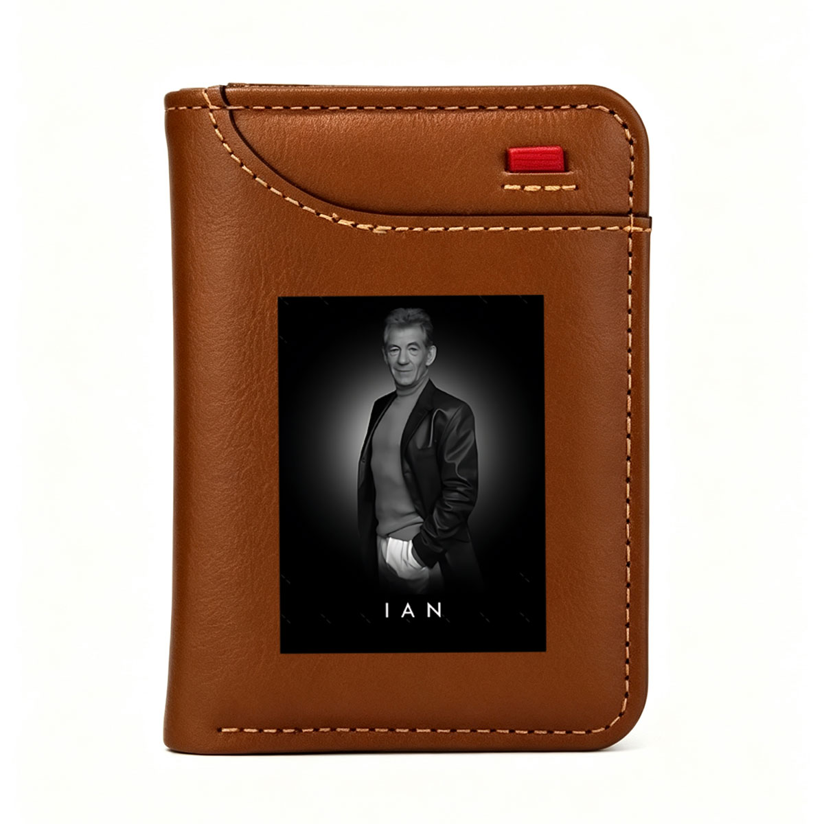 Ian McKellen in a stylish black suit, exuding elegance and confidence against a dark background. - Vertical Style Wallet