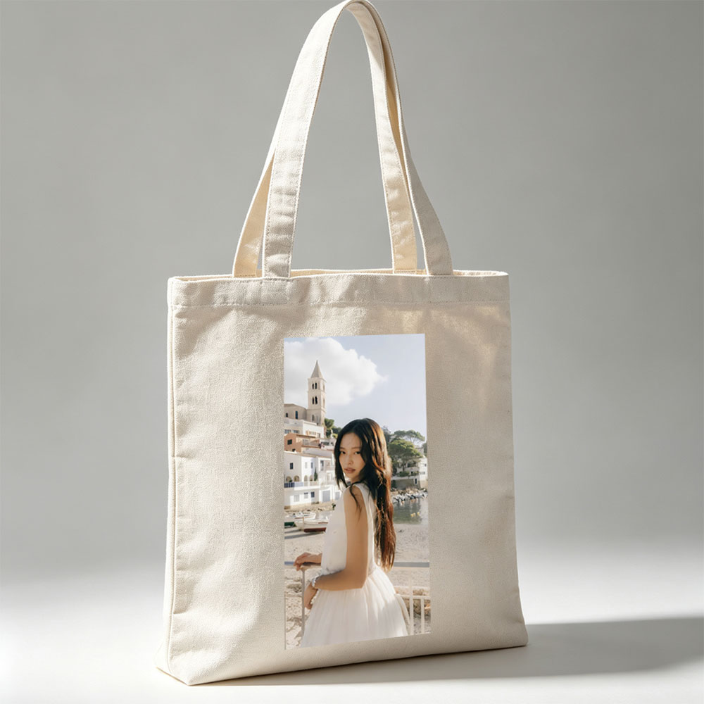 Jennie Kim in a White Dress by the Seaside with a Church Tower in the Background - Canvas tote bags