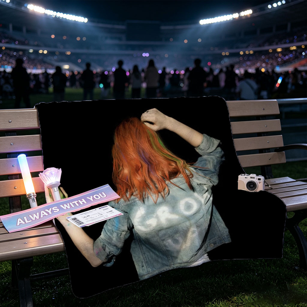 BTS Jungkook in a vibrant performance scene with colorful hair and denim jacket against a black background - Blankets