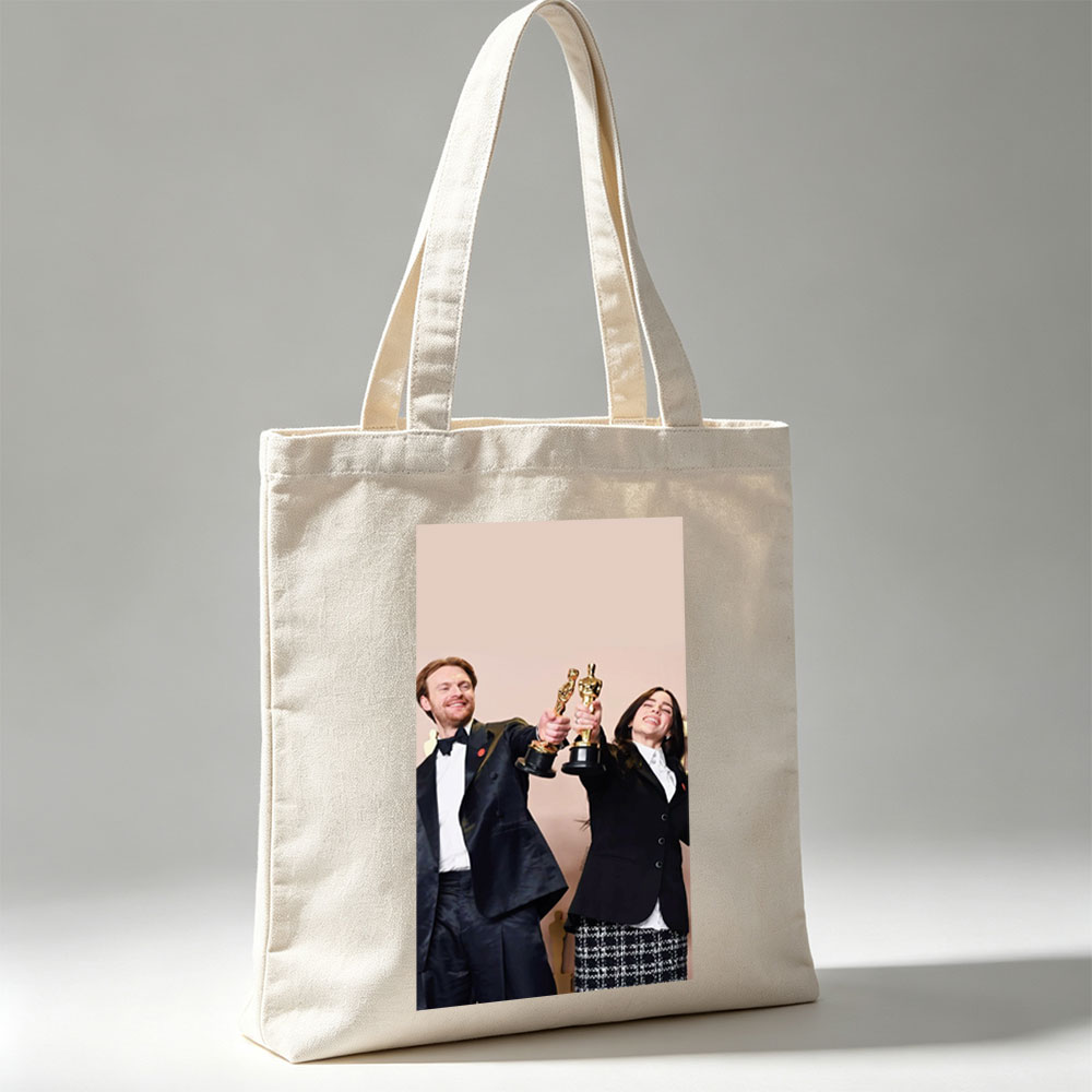 Emma Stone and Damien Chazelle Holding Oscars at the Academy Awards Ceremony - Canvas tote bags