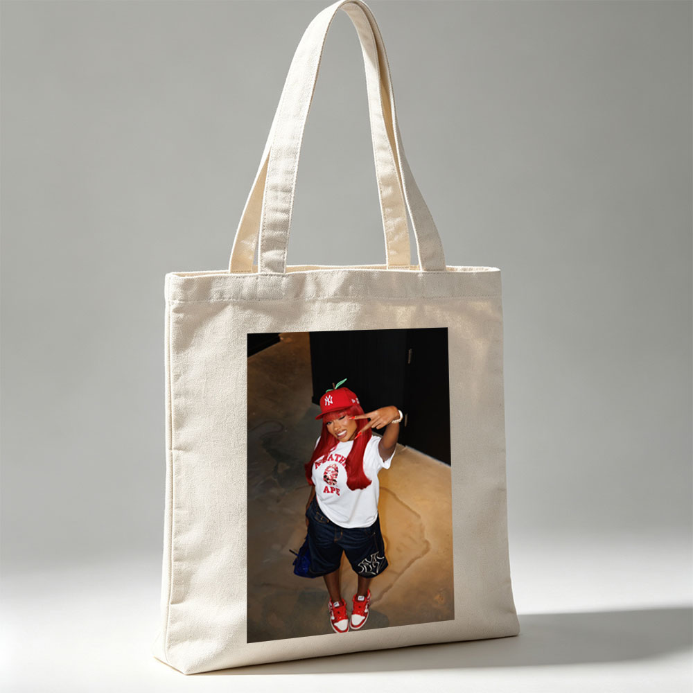 Nicki Minaj in a Red Apple Hat and A Bathing Ape Shirt, Striking a Pose with a Peace Sign - Canvas tote bags