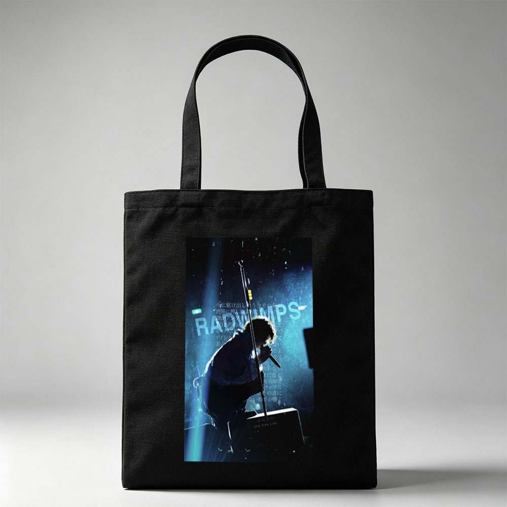 RADWIMPS Live Performance - Singer on Stage with Microphone and Dramatic Lighting - Canvas tote bags