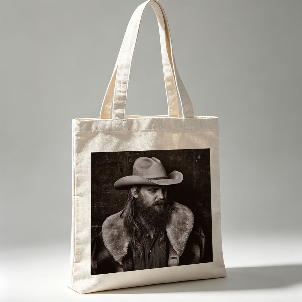 Chris Stapleton in a Cowboy Hat and Fur-Collared Jacket, Gazing Thoughtfully in a Monochrome Portrait - Canvas tote bags