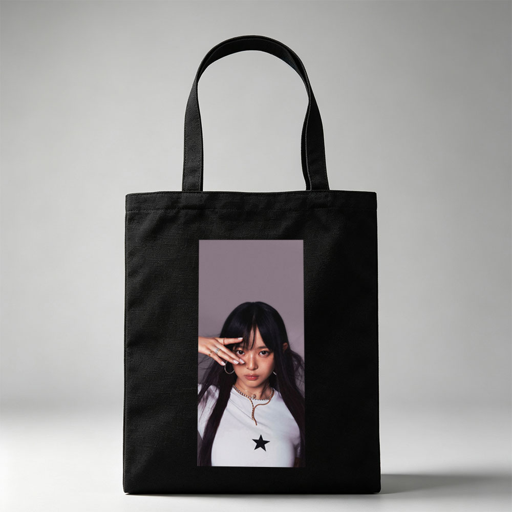Hanni of NewJeans in a Stylish Pose with Star-Printed White Top and Elegant Jewelry - Canvas tote bags