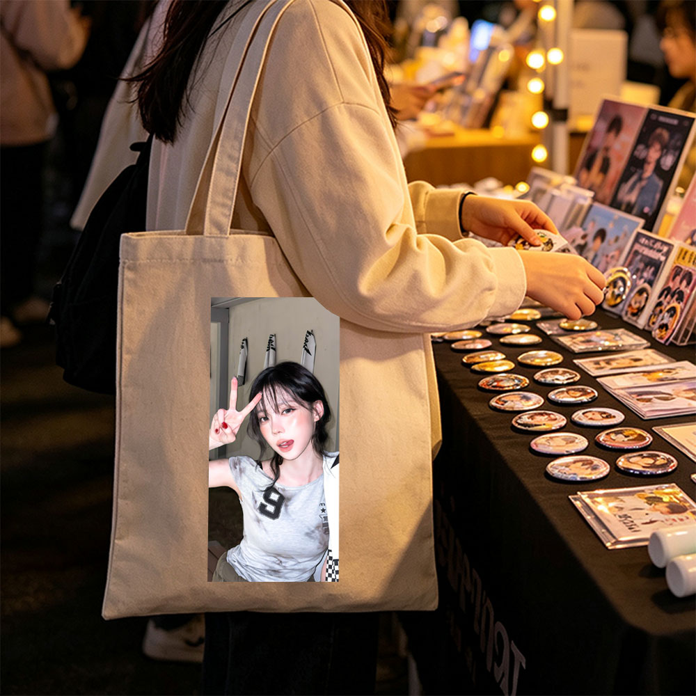Korean Celebrity in Casual Outfit Making Peace Sign in Indoor Setting - Canvas tote bags
