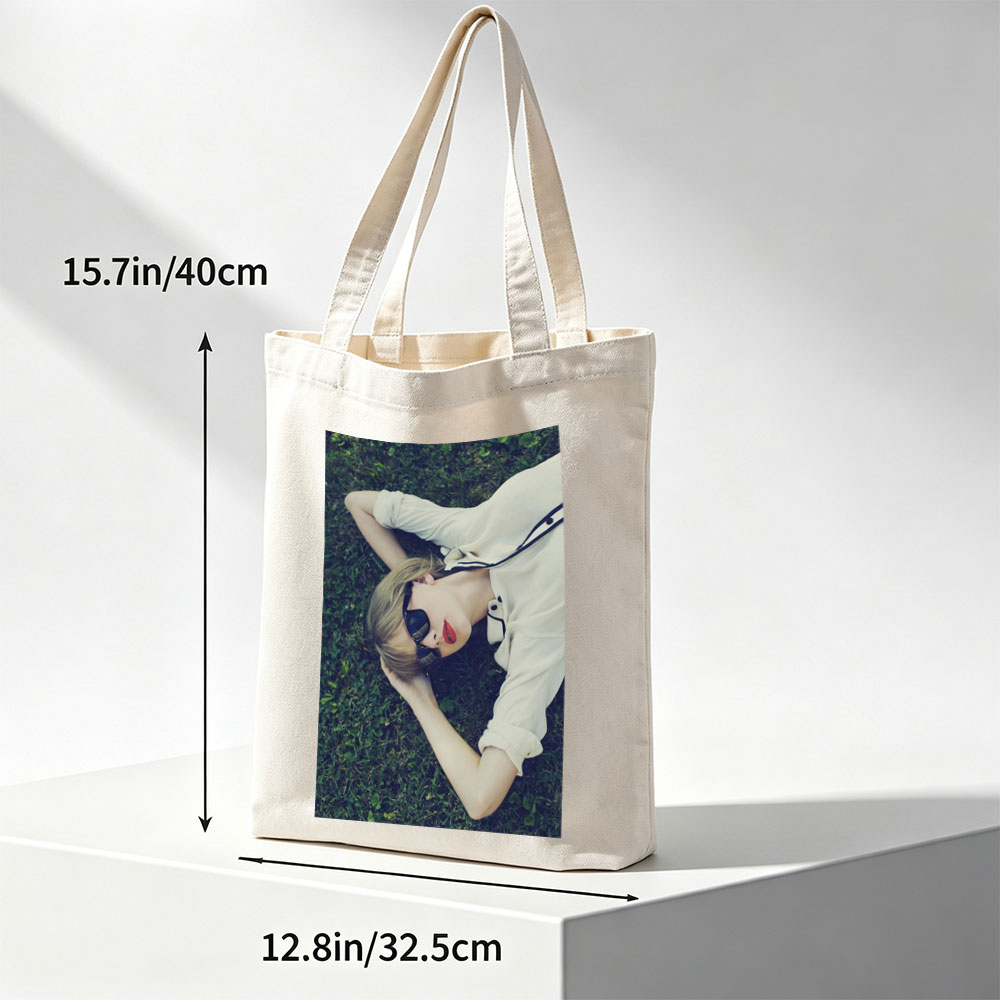 Taylor Swift Lying on Grass Wearing Sunglasses and Red Lipstick - Canvas tote bags