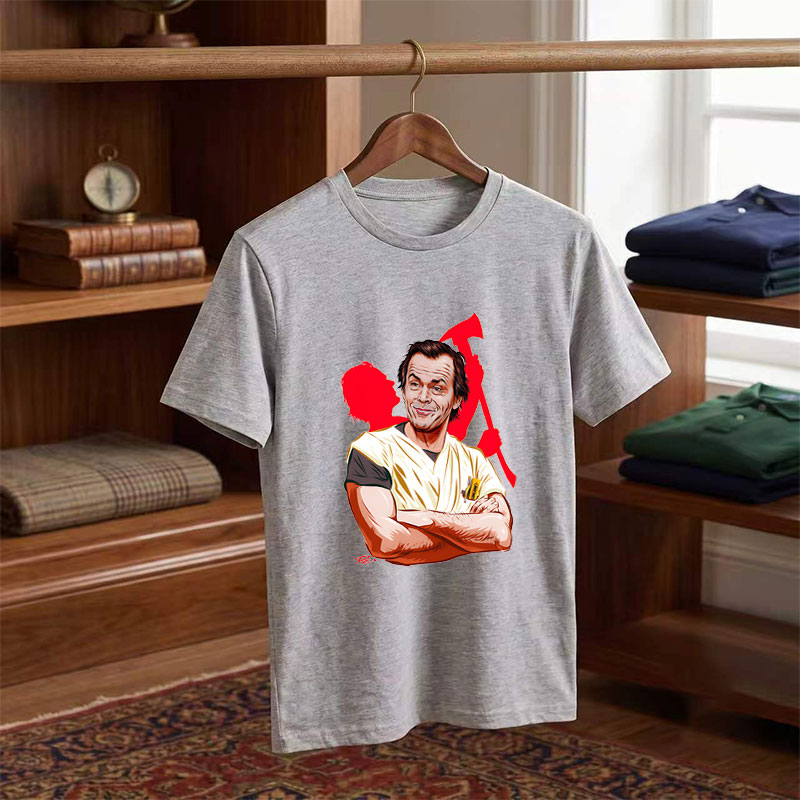 Jack Nicholson as the Joker, iconic villain from Batman, depicted in a stylized caricature with a menacing grin and chaotic red background. - Tee