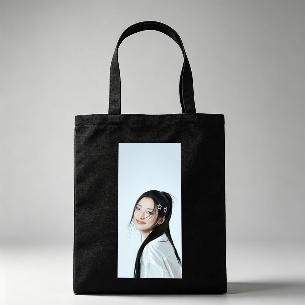 Korean Actress in White Outfit with Star Hair Clips Smiling Softly Against Light Blue Background - Canvas tote bags