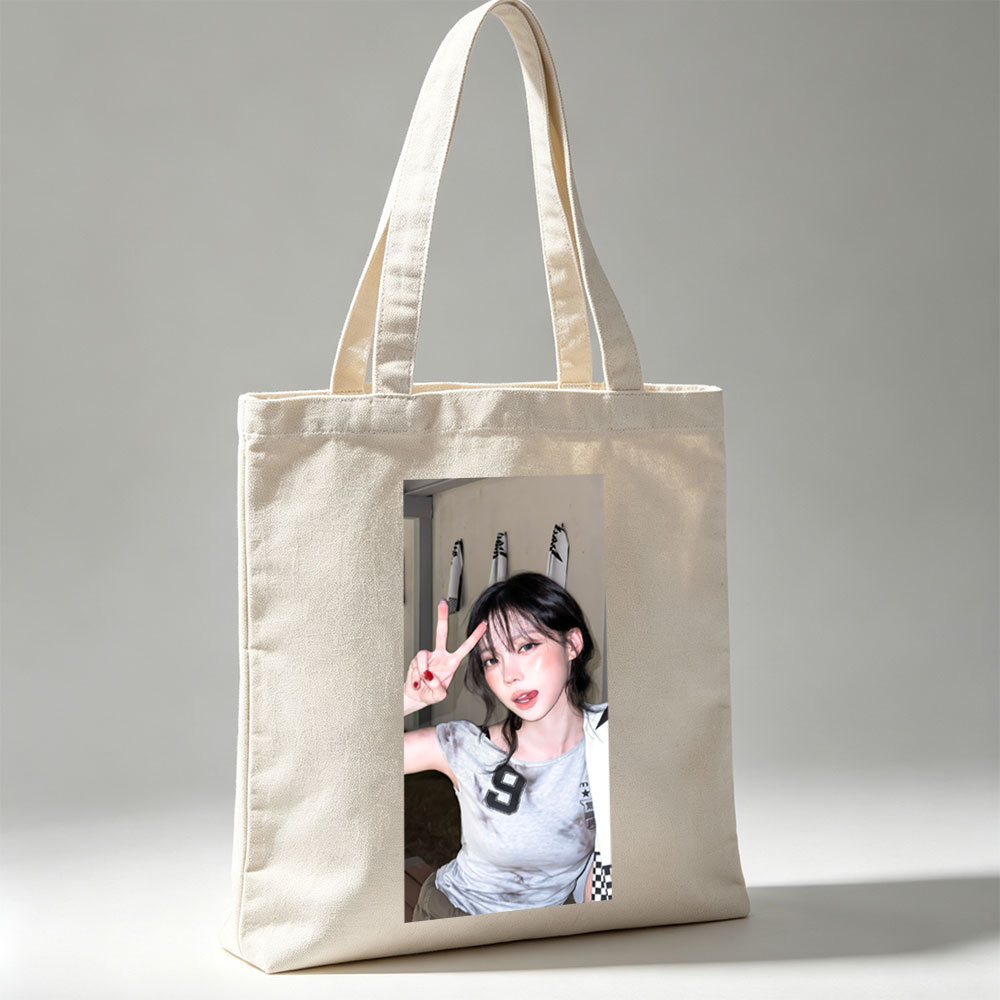 Korean Celebrity in Casual Outfit Making Peace Sign in Indoor Setting - Canvas tote bags