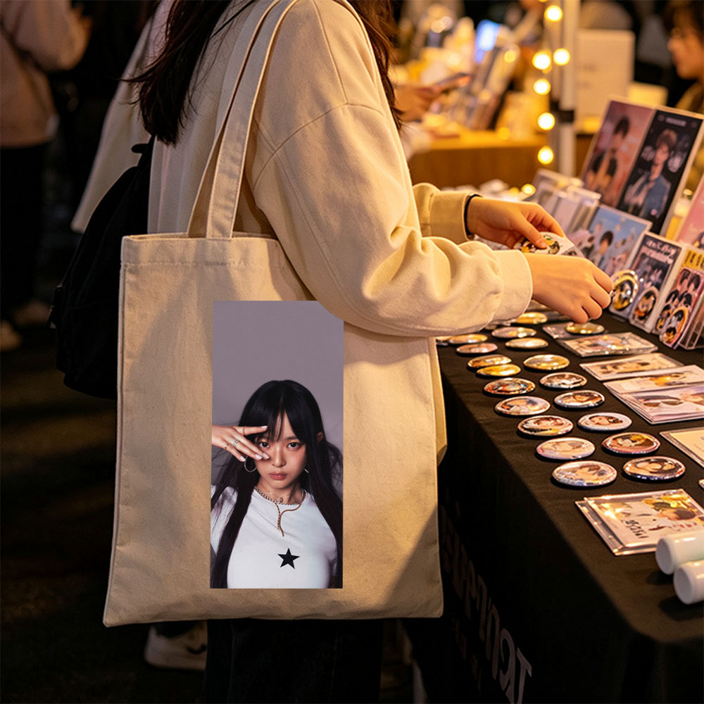 Hanni of NewJeans in a Stylish Pose with Star-Printed White Top and Elegant Jewelry - Canvas tote bags