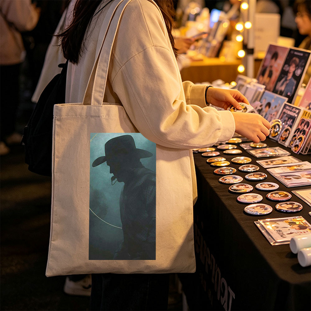 Johnny Cash in the Mist – Silhouette of a Cowboy with Hat and Pipe Against a Foggy Background - Canvas tote bags
