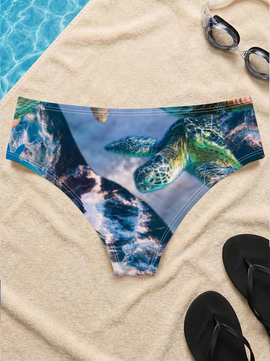 Turtles, stars, and flowers in a heart-filled ocean scene -  Men's swim trunks