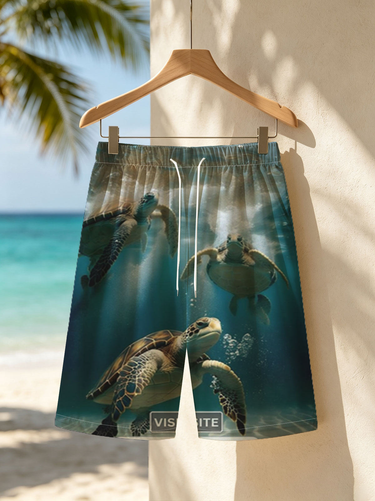 Three sea turtles swimming gracefully underwater in clear blue ocean. -  Beach shorts