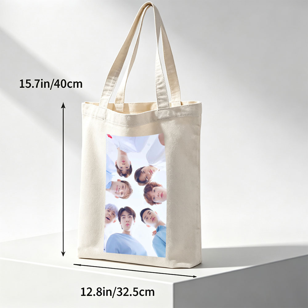NCT Dream Members in a Circular Formation Wearing Light Blue Outfits Against a Bright Sky Background - Canvas tote bags