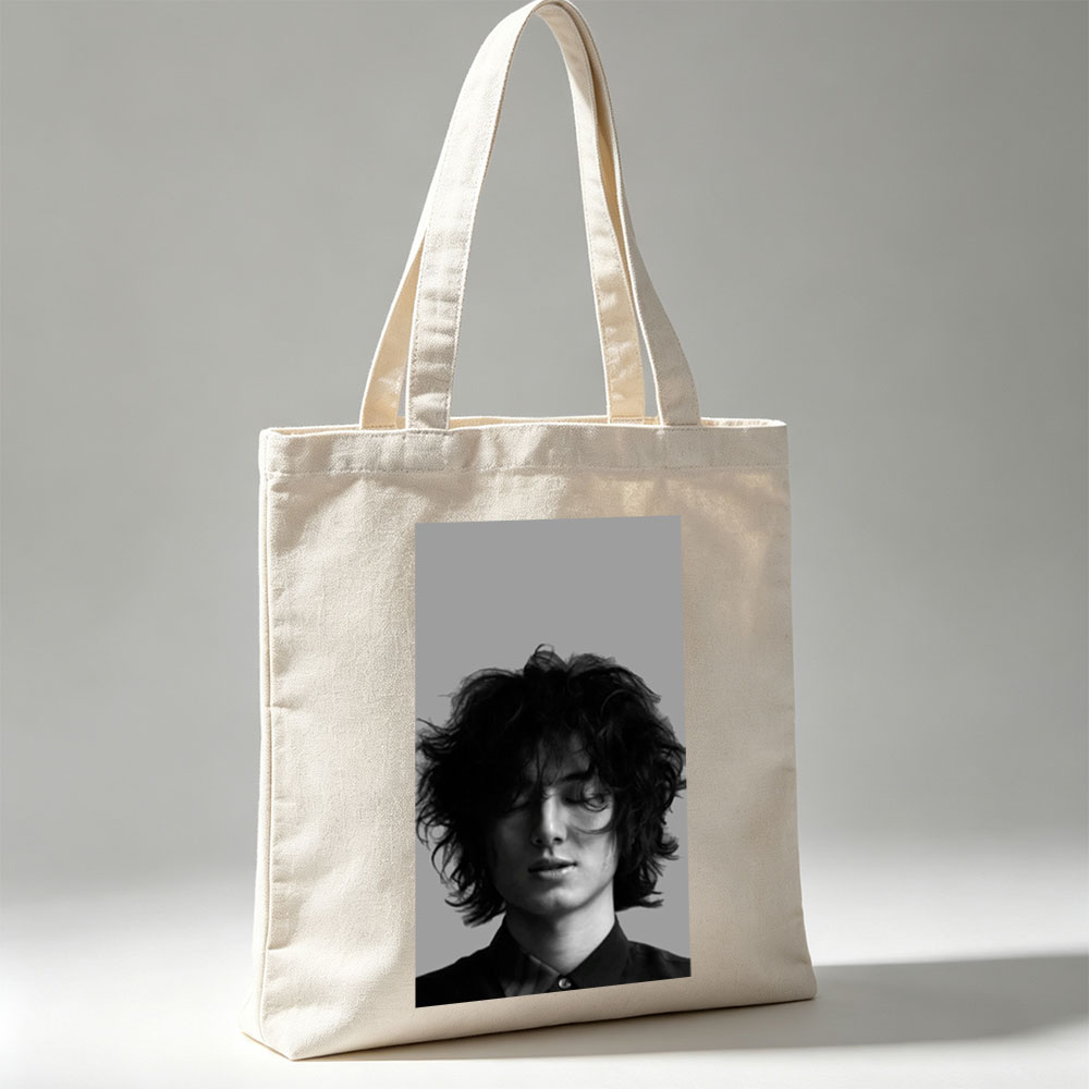 Timothée Chalamet Close-Up Black and White Portrait with Messy Hair and Closed Eyes - Canvas tote bags