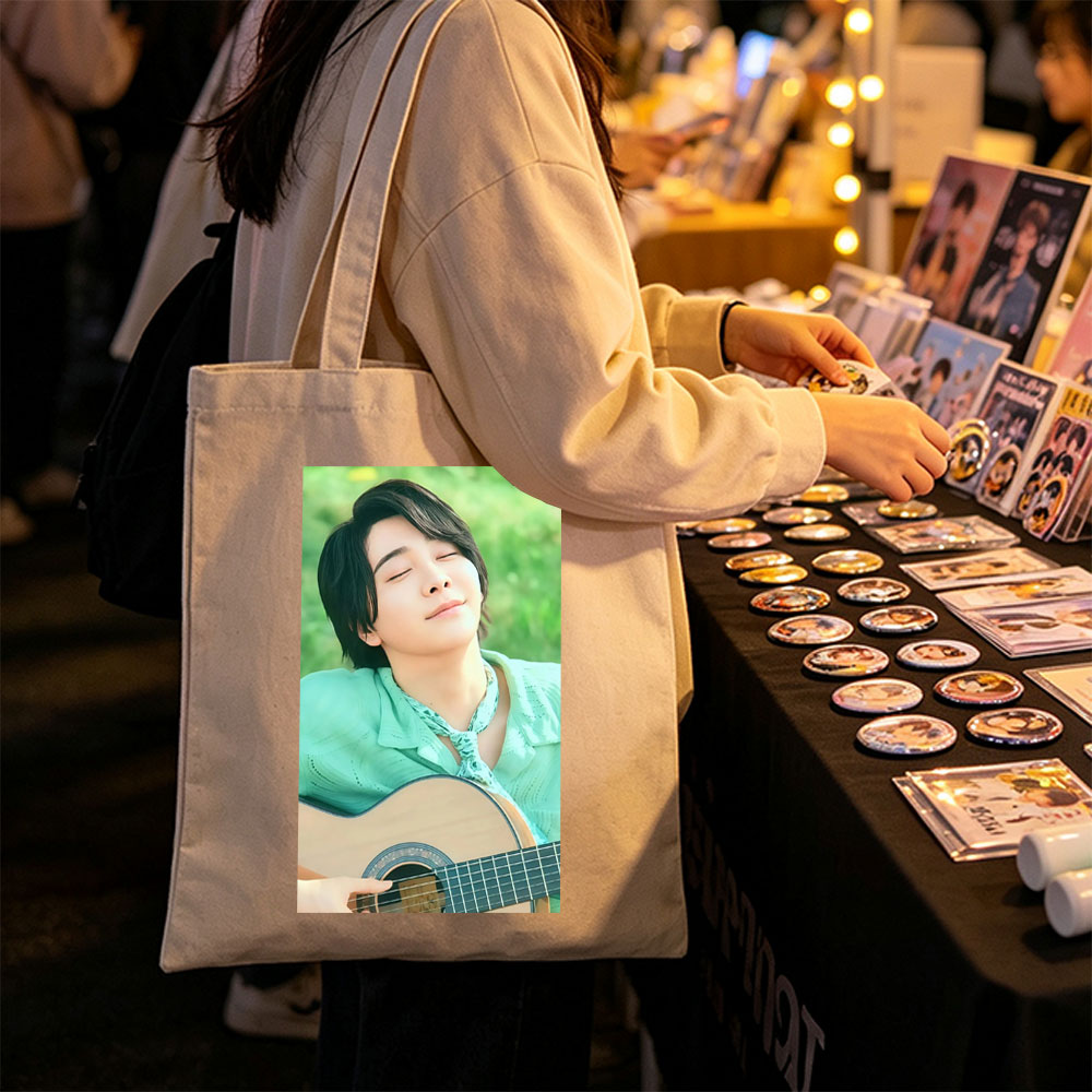 Yuki Kajiura in a Serene Outdoor Setting Playing Acoustic Guitar with Eyes Closed - Canvas tote bags