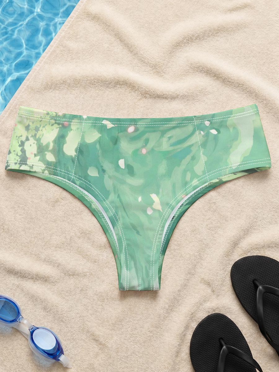 A woman floats gracefully in emerald waters, surrounded by blooming flowers and gentle ripples. -  Men's swim trunks