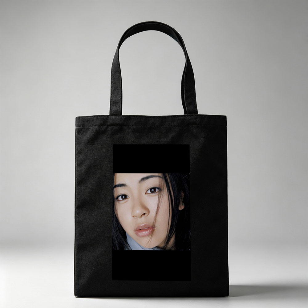 Yuki Kajiura in a Close-Up Portrait with Soft Lighting and Gentle Expression - Canvas tote bags