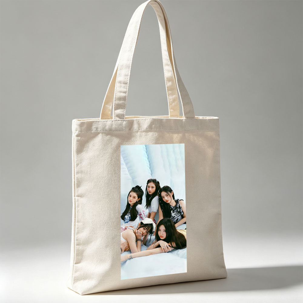 NewJeans Group Photo on Soft Blue Background with Casual Outfits and Relaxed Poses - Canvas tote bags