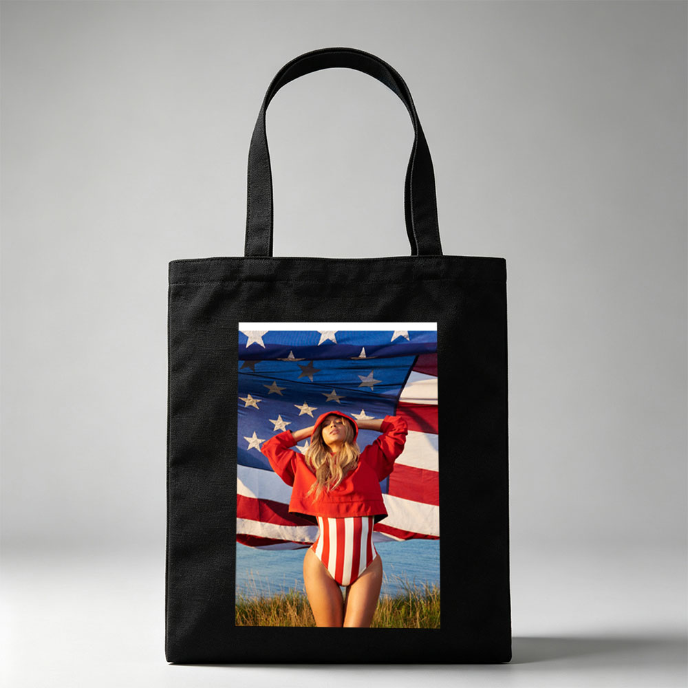 Beyonce in Red Hoodie and Striped Bodysuit Standing Before American Flag by the Beach - Canvas tote bags
