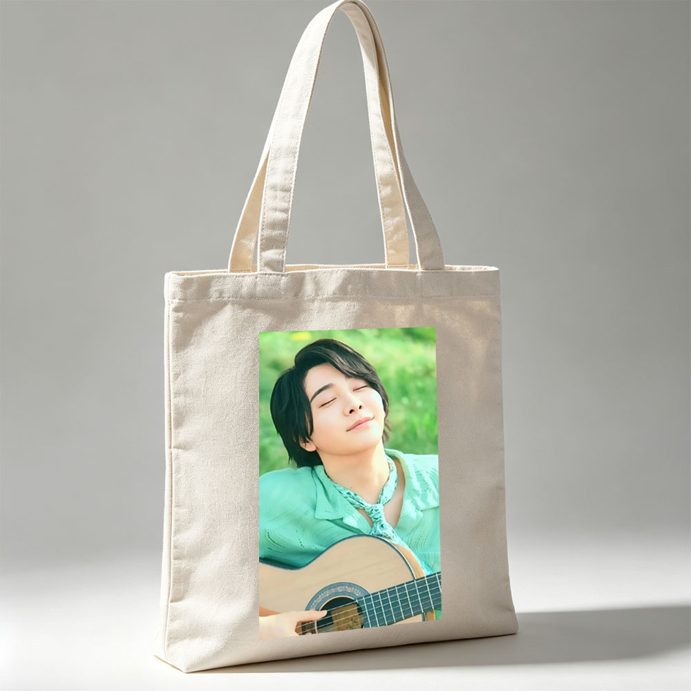 Yuki Kajiura in a Serene Outdoor Setting Playing Acoustic Guitar with Eyes Closed - Canvas tote bags