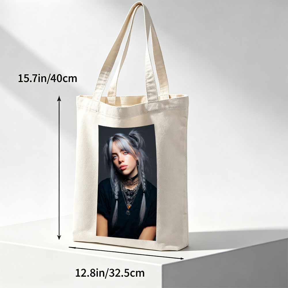 Billie Eilish in a striking portrait with silver hair styled in braids, wearing layered necklaces and a black top against a dark background. - Canvas tote bags