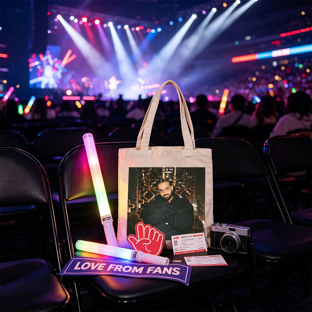 Drake in a Stylish Pose Against an Ornate Background Wearing Glasses and a Black Hoodie - Canvas tote bags