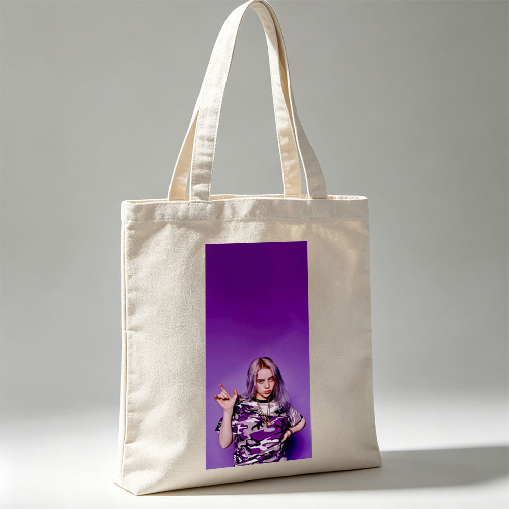 Billie Eilish in Purple Camo Outfit Making Hand Gesture Against Vibrant Background - Canvas tote bags