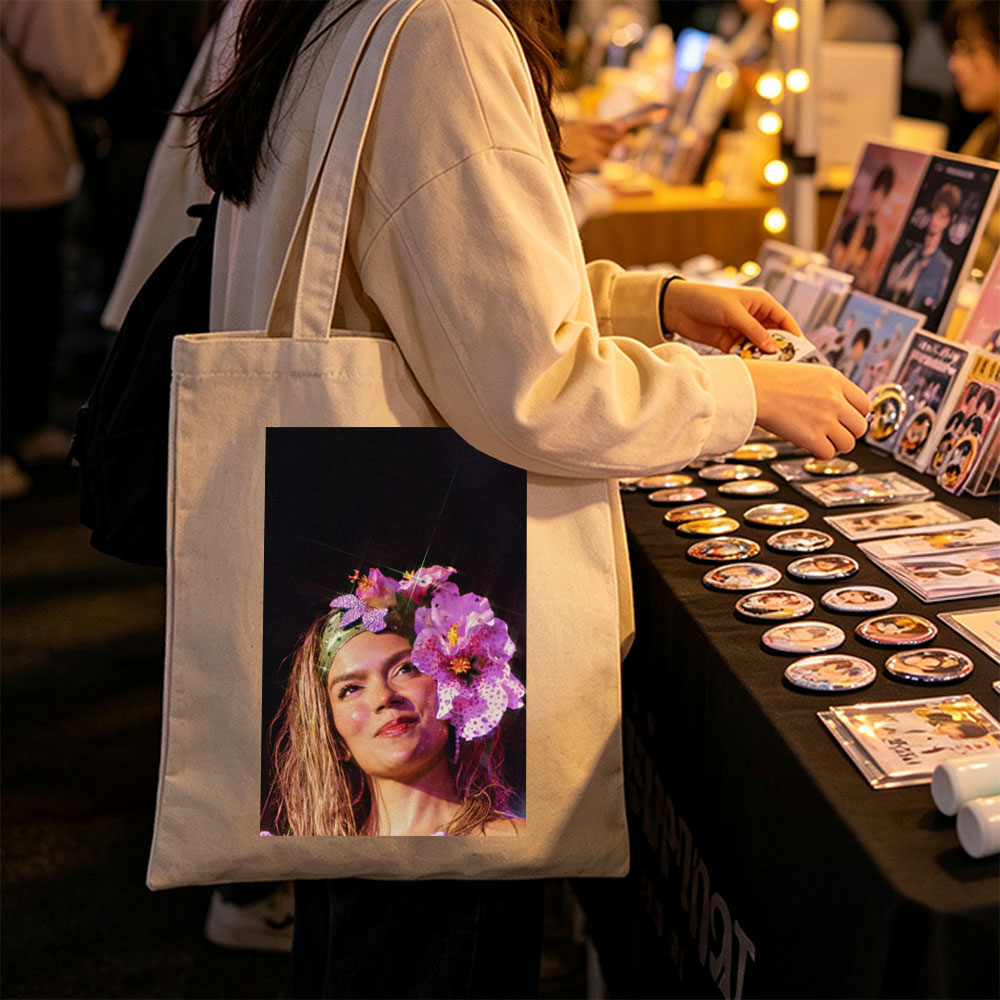 Rita Ora Wearing a Floral Headpiece at a Performance - Canvas tote bags