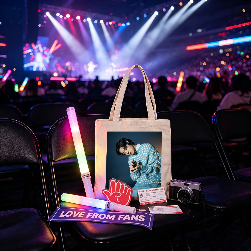 Jaden Smith in a Stylish Blue Sweater Holding a Perfume Bottle with Headphones On - Canvas tote bags