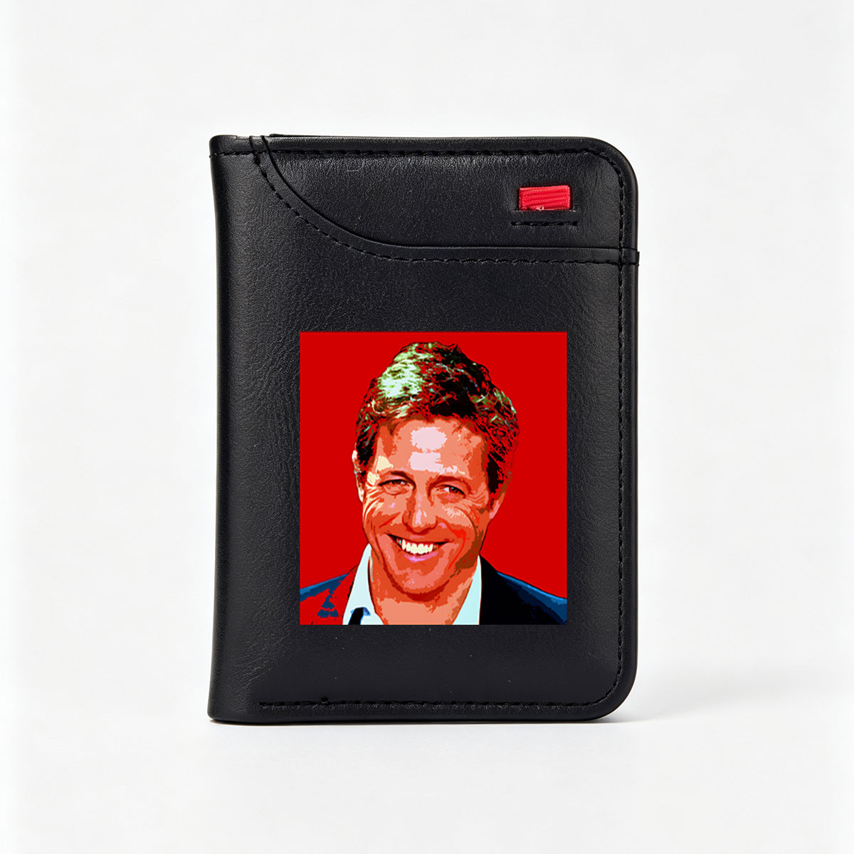 Hugh Grant in a vibrant, stylized portrait with bold red background and pop art effect. - Vertical Style Wallet